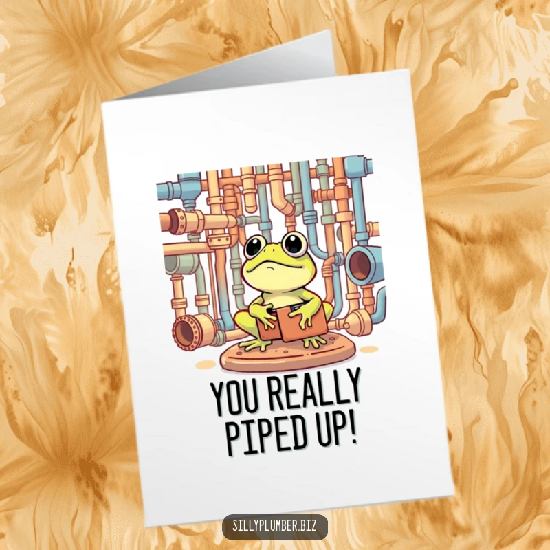 Funny Free Printable Congratulations Card featuring a frog with a toolbox, happily surveying a complex network of pipes, to celebrate their achievements.