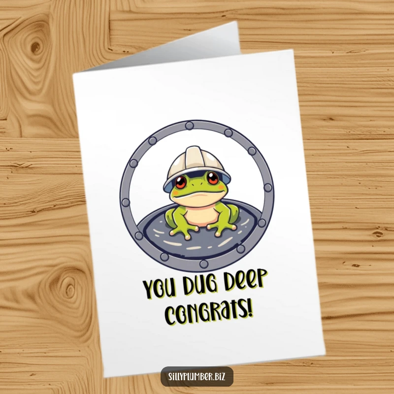 Funny Free Printable Congratulations Card featuring a frog in a hard hat, curiously peeking out from a manhole cover, to celebrate big wins.