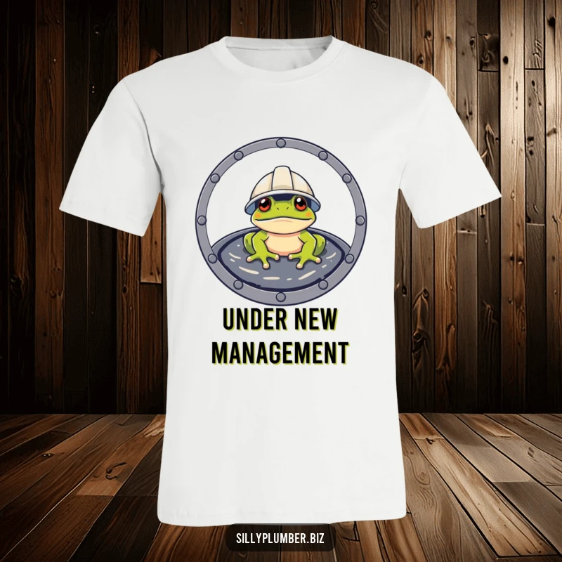 Funny T-Shirt of a frog wearing a hard hat, peeking from a manhole, symbolizing ready-to-work attitude.