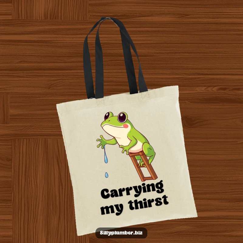 Funny Tote Bag illustrating a frog stuck on a ladder, humorously reaching for a single water drip.